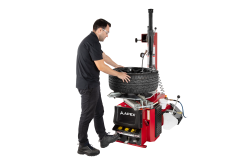 APEX AT26 swing arm tire changer for passenger and light truck wheels in a small shop setting