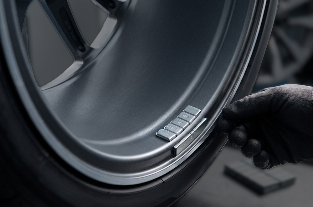 DST30PX wheel balancer showing precise one-spin weight placement on alloy wheel